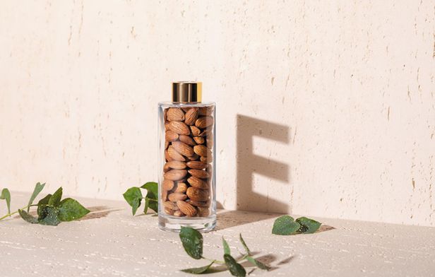 a glass bottle filled with almonds