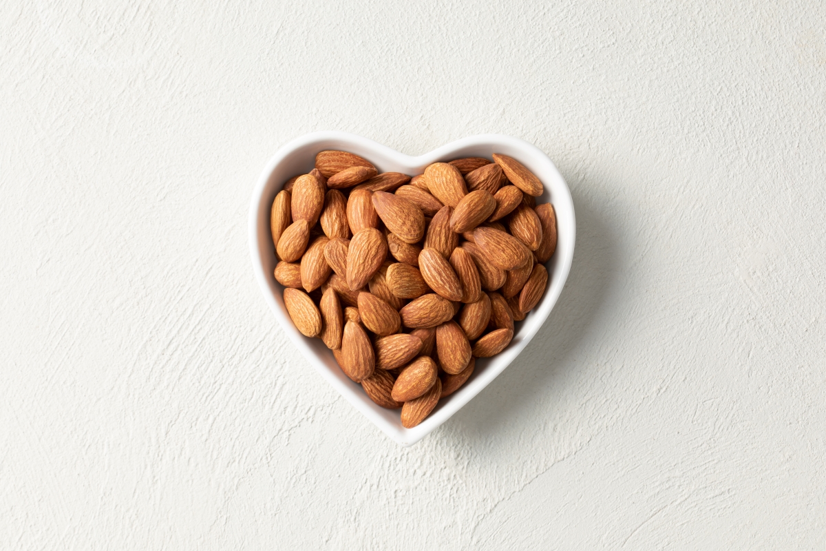 Bunch of almonds in a heart bowl
