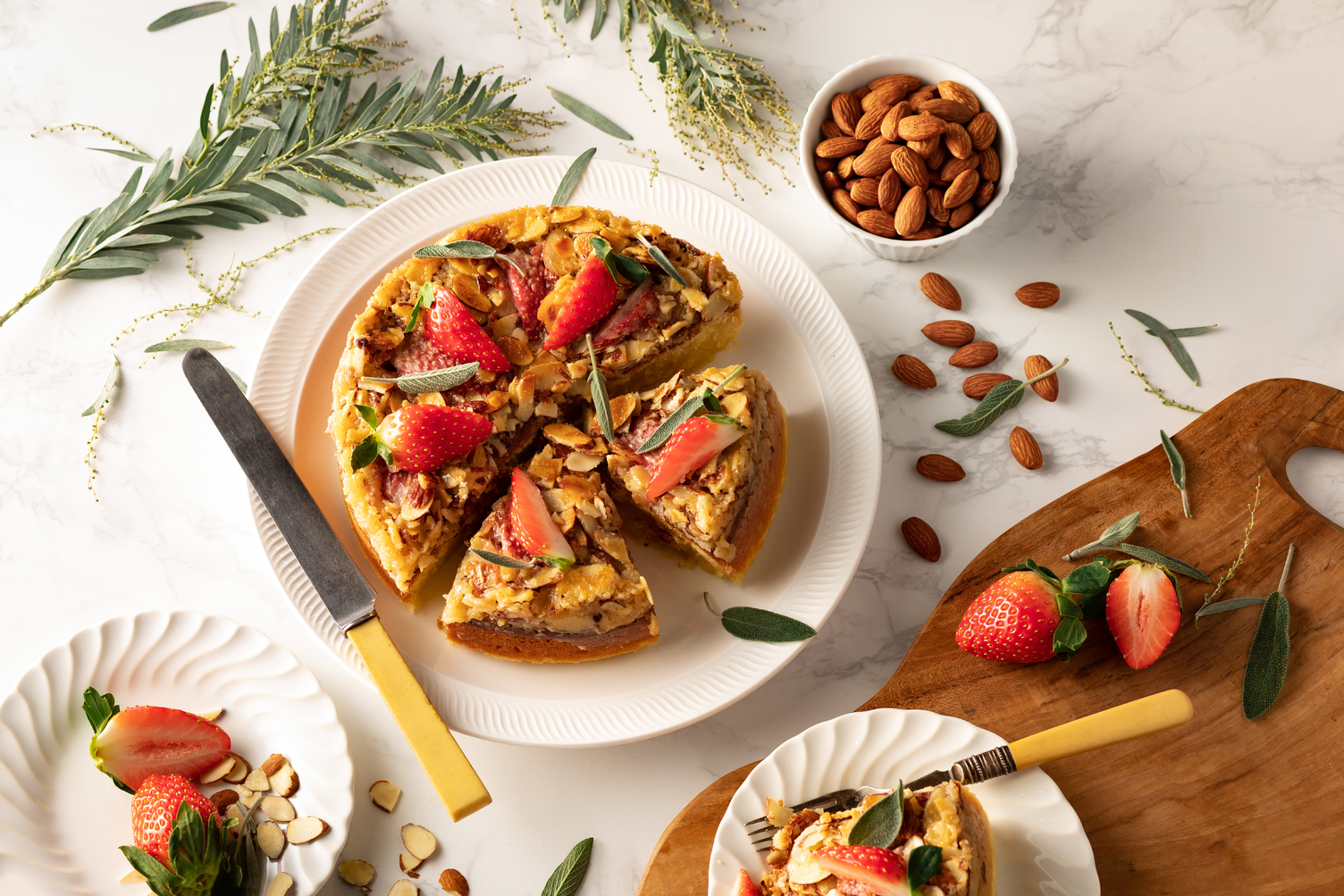 Almond cake with strawberries on a table setting