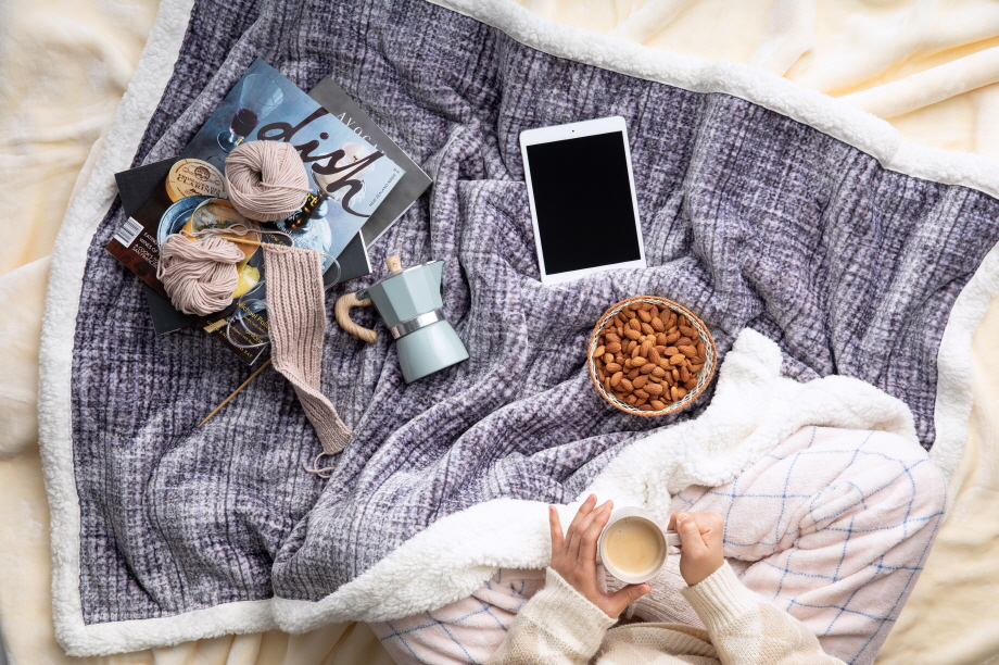 almonds on bed with other cozy winter items