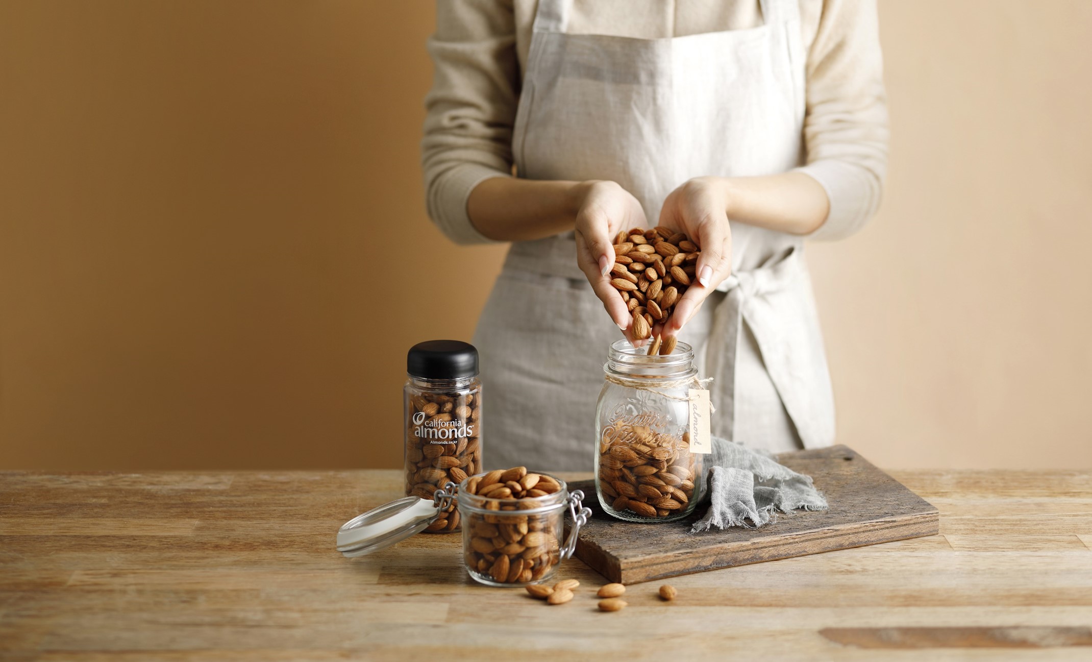 woman holding a handful of almonds