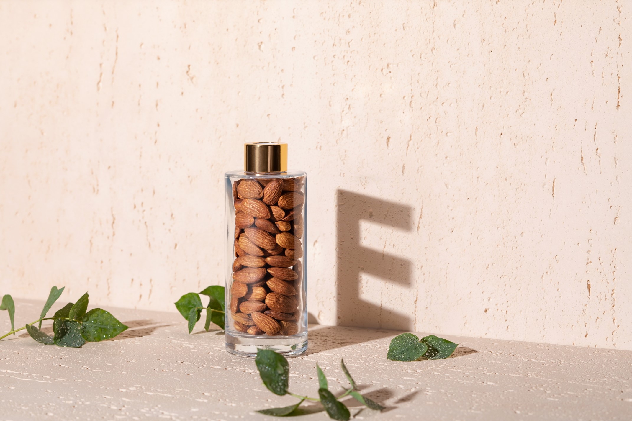 almond bottle with vitamin E written in the background